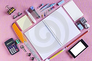 Colorful School Supplies Organized by Type Around Note Book Open to Blank Page Arranged