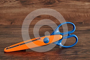 A colorful scissor that cut a zigzag pattern