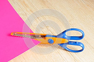 A colorful scissor that cut a zigzag pattern