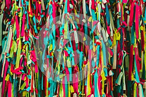 Colorful scrappy fabric. Colorful peaces of clothes be bind together on tree by people who believed this will exorcise their fate.