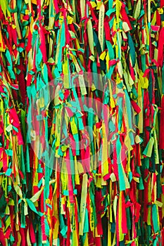 Colorful scrappy fabric. Colorful peaces of clothes be bind together on tree by people who believed this will exorcise their fate.