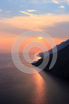 Colorful sea and sundown clouds between Brela and Baska Voda in Dalmatia, Croatia