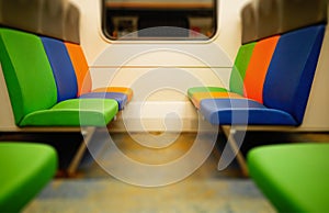 Colorful seats in train carriage background