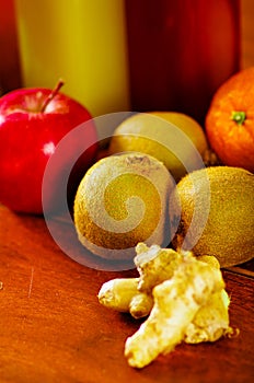 Colorful selection of fresh fruits and vegetables spread out on wooden surface, beautiful colors