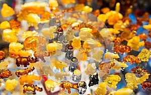 Colorful set of amber - a collection of animal figurines - a typical souvenir from Gdansk, amber workshops in Mariacka Street in