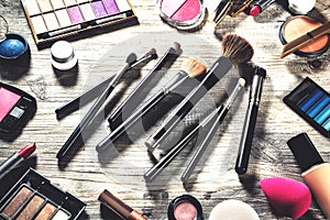 Colorful set with various makeup products and brushes