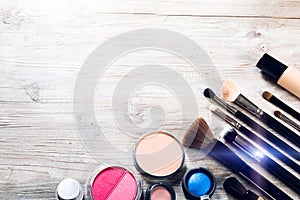 Colorful set with various makeup products and brushes