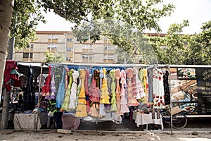 Colorful sevillana costumes at a street market in Spain photo
