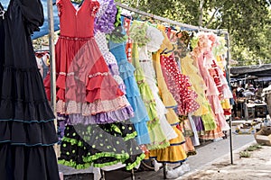 Colorful sevillana costumes at a street market in Spain