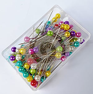 colorful sewing pins on a white background