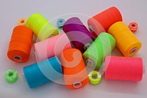 Colorful Sewing Thread Spools on Table