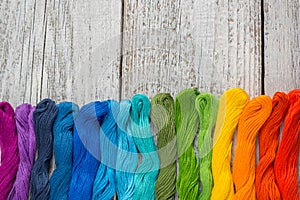 Colorful sewing threads for embroidery on white background
