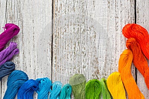 Colorful sewing threads for embroidery on white background