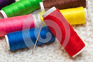 Colorful sewing threads in the studio close-up