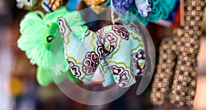 Colorful sewn fabric toys at market