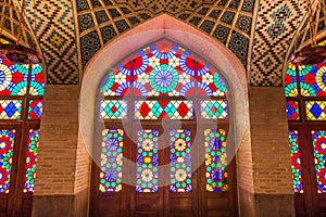 Colorful shining stained glass windows of Nasir Al-Mulk Mosque Pink Mosque in Shiraz, Iran