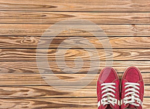 Colorful shoes set on wooden background with copy space. Top view.