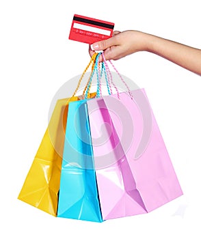 Colorful Shopping Bags and Credit Card in Female Hand isolated