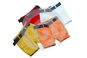 Colorful shorts whith belts laying on each other