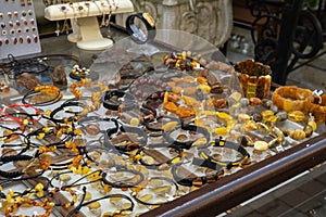 Colorful showcases of traditional jewelry stores and amber gemstone products in city market square in Gdansk Poland