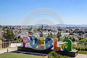 Colorful Sign for Puebla overlooking the city from Los Fuertes photo
