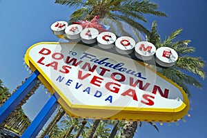 Colorful sign reads ï¿½Welcome to Fabulous Las Vegas, Nevadaï¿½ in daytime with blue sky