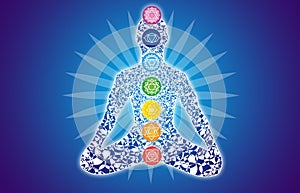 Colorful silhouette of a yogi in a lotus pose against a blue sbackground