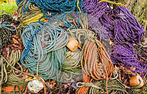 Colorful sink, hydropro and float ropes used for lobster traps sit in a big pile