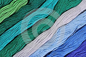 Colorful skeins of floss as background texture