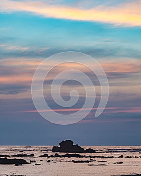 Colorful sky captured at sunset over a shoreline, background with pastel colors