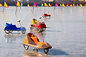 Colorful sleighs in car design on ice sheet