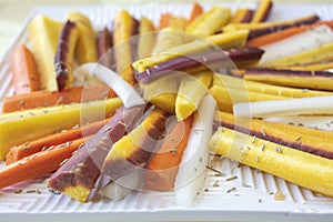 Colorful Sliced Raw Carrots with Rosemary Herb