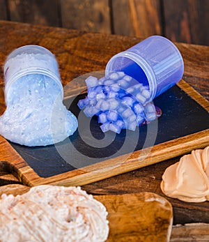 Colorful slimes on a wooden board