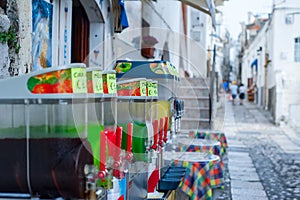 Colorful slushes on display in the historical center of an italian sea town