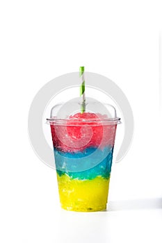 Colorful slushie with straw in plastic cup