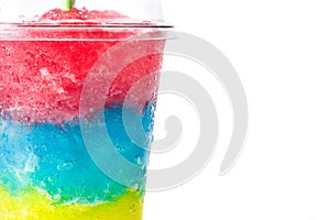 Colorful slushie with straw in plastic cup photo