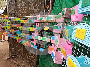 Colorful small baskets For putting the merit money, Thailand.