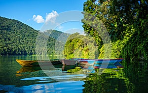 Colorful small boats on Phewa Lake in Pokhara