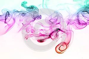 Colorful smoke abstract on white background. movement of ink water