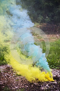 Colorful smoke bombs being lit on the fourth of July