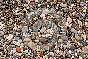 Colorful and smooth stones on the beach in Kemer, Turkey.