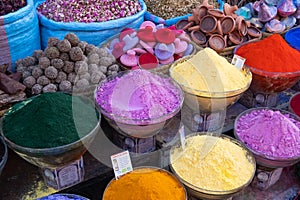 Colorful soaps, spices and perfumes for sale in a market in a souk in the Medina around the Jemaa el-Fnaa square in