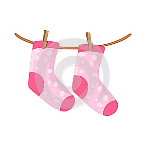Colorful socks hanging on rope isolated on white background. Pink socks on clothesline.