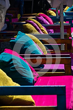 Colorful sofas in front of pubs in Oldtown Bucharest