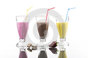 Colorful sommer frappes with reflection on bright background