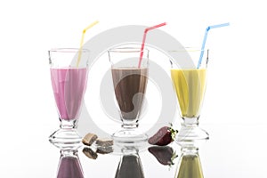 Colorful sommer frappes with reflection on bright background photo