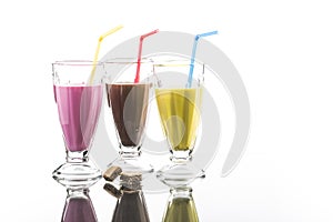 Colorful sommer frappes with reflection on bright background