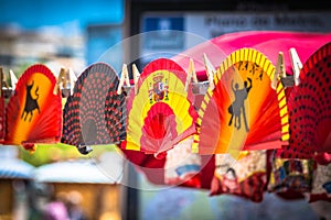 Colorful Spanish Fans arranged for sale in a store