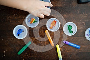 Colorful sparkle glitter glue. Arts and crafts on wooden background