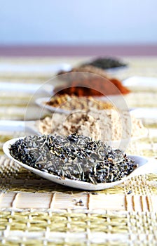 Colorful spicery on a straw table-bedding